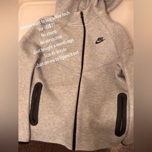 Grey Nike tech zip up hoodie, no scratches, no stains, and size XL in kids.